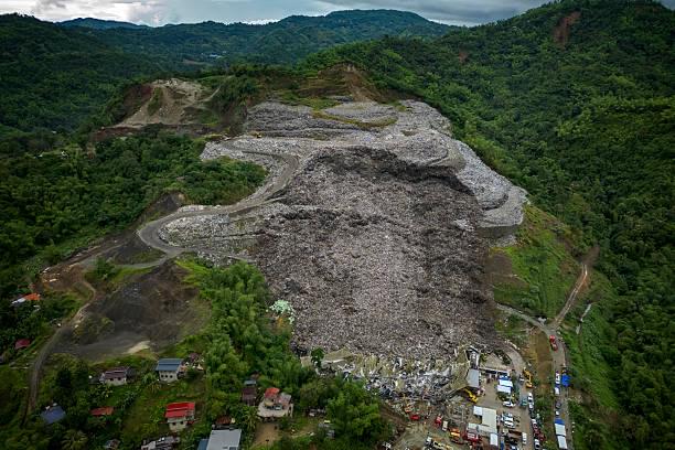 One dead, dozens trapped after giant landfill collapses in Philippines