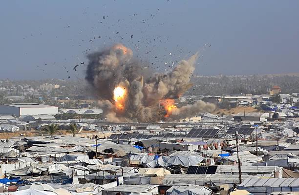 Israeli air strikes kill at least 32 Palestinians in Gaza, rescue officials say
